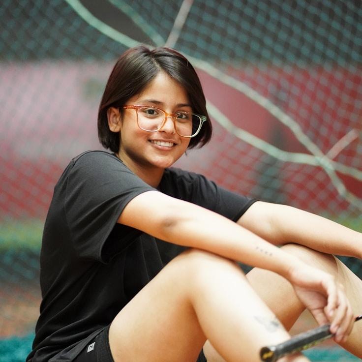 Aarav Singh, Lead Design Curator at Golden River Horizon, reviewing corporate floral arrangements